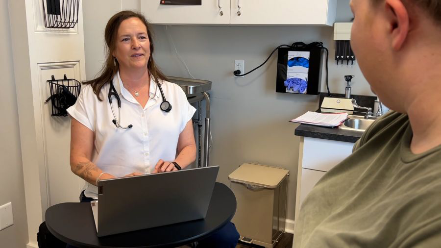 Jennifer talking to a patient.