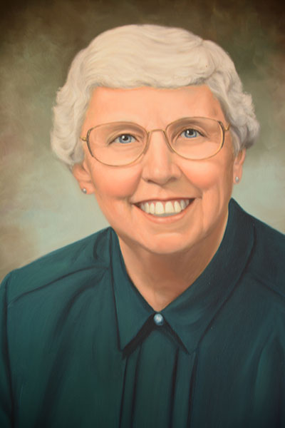 Former Dean Payne smiling in a suit
