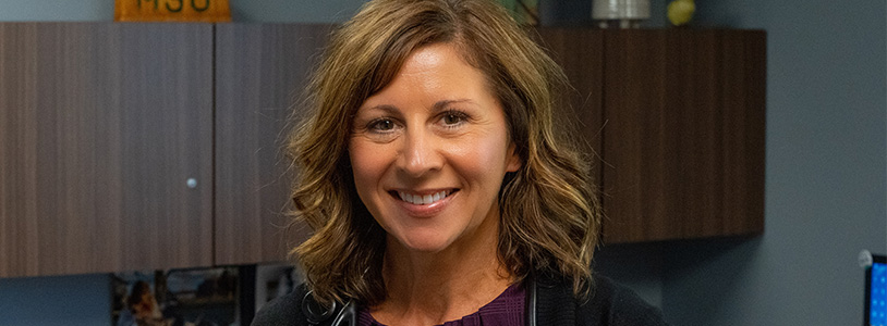 Brenda Kretzschmer in office, smiling